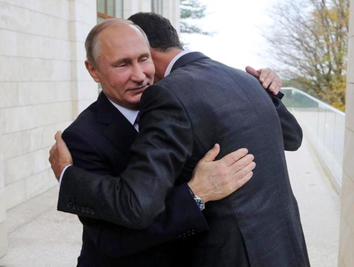 Putin Assad hug